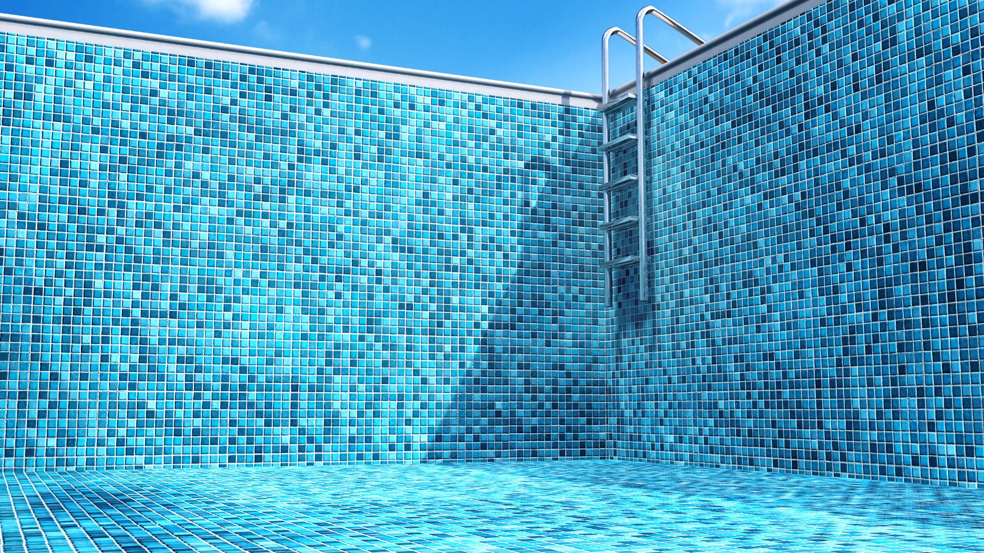 Empty swimming pool with blue mosaic tiles and metal ladder