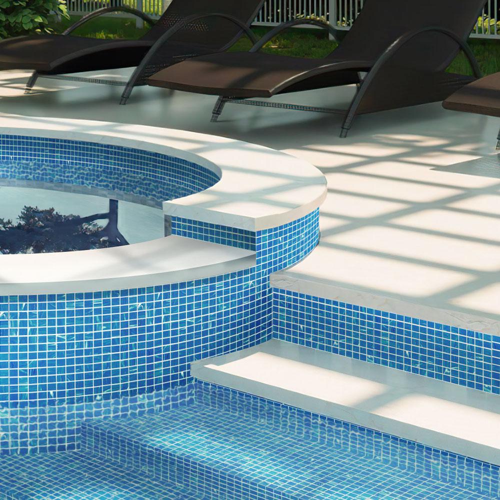 Close-up of vibrant, clean blue and white glass pool tiles with a clear gloss tile sealer applied.